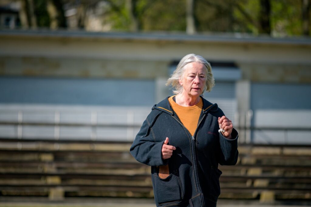 elderly woman in black jacket